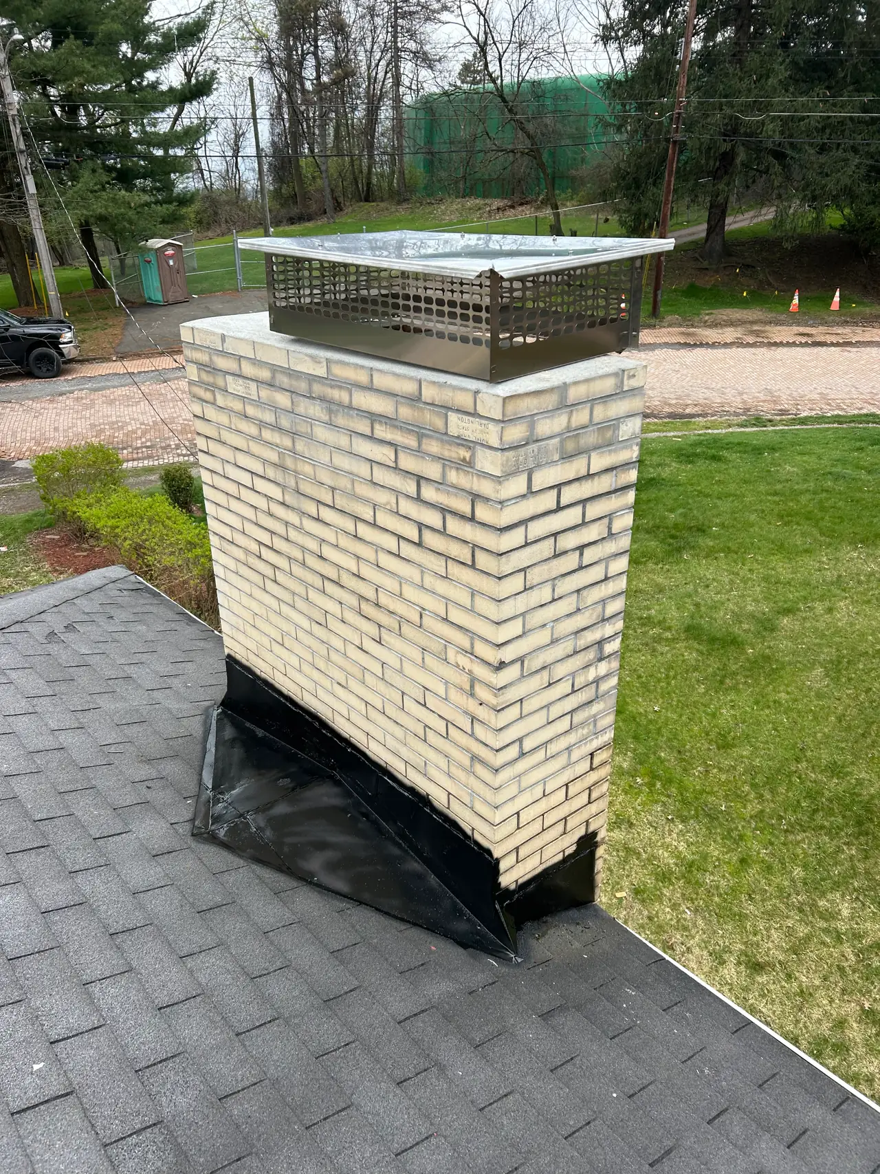 Stainless steel multiflue chimney cap I installed on a buff brick chimney with new black flashing in Verona, PA
