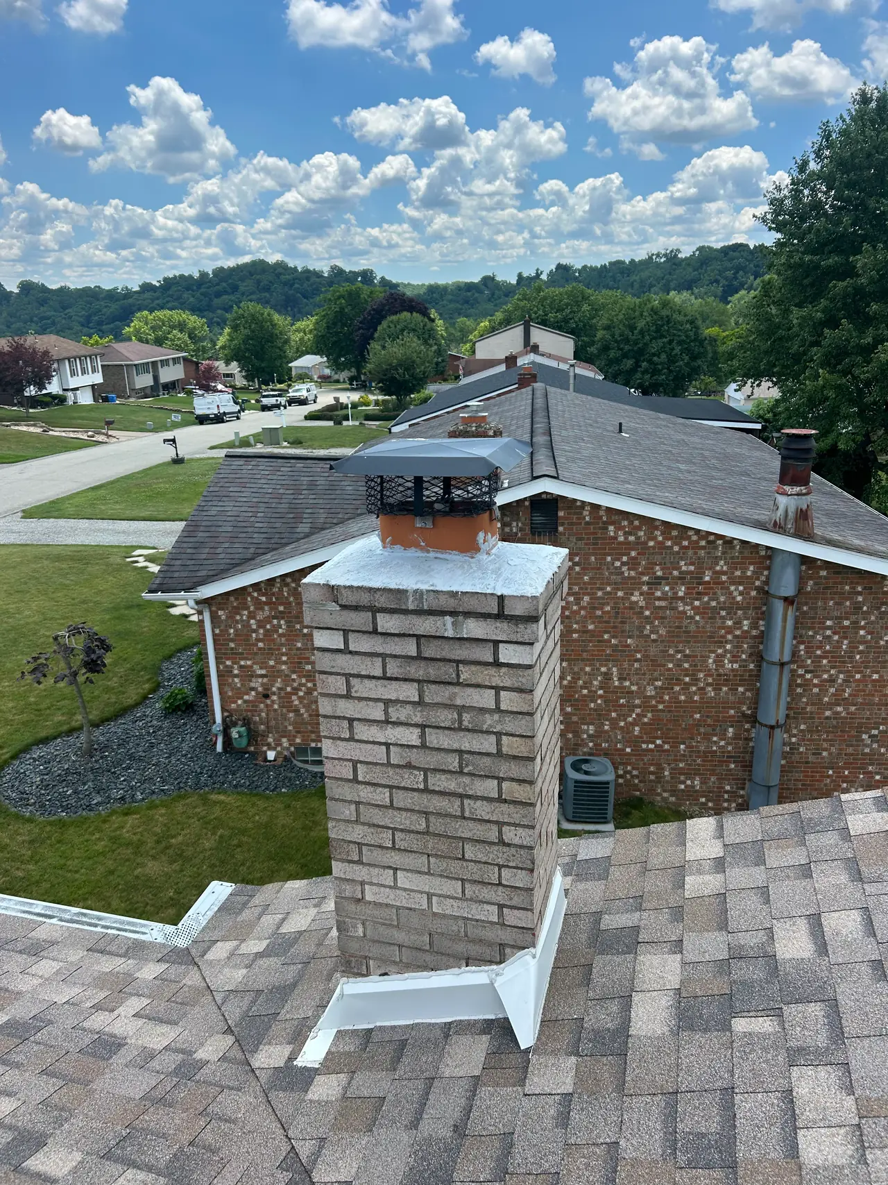 Brick chimney in Irwin, PA with a fresh waterproof crown coat and a new top-mount damper I installed