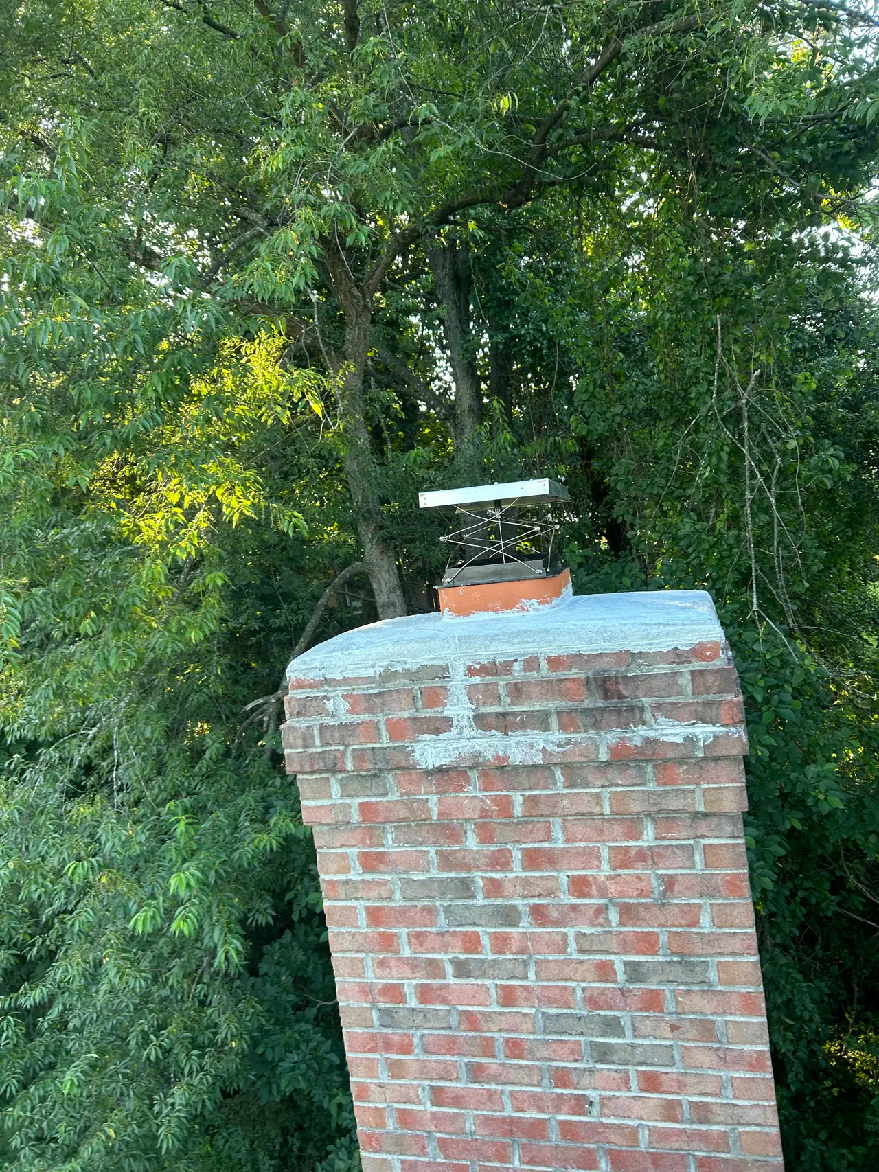 The same Fox Chapel, PA chimney after a crown sealing and a new top-mount damper set on the flue