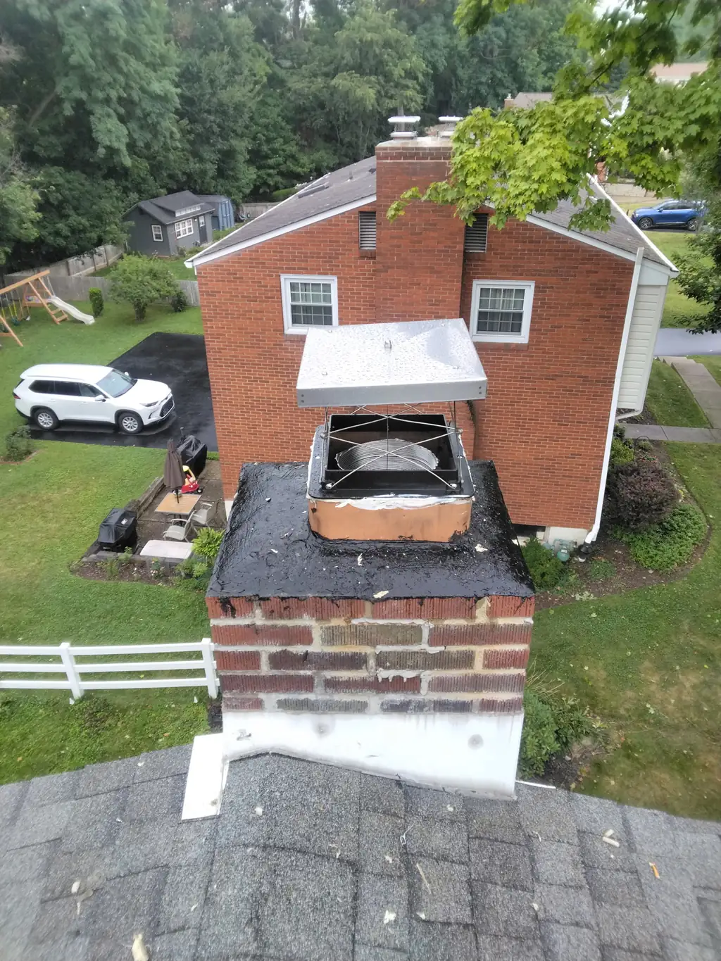 Top-sealing damper installed at the crown of a Bethel Park, PA chimney, open with the new liner visible below it