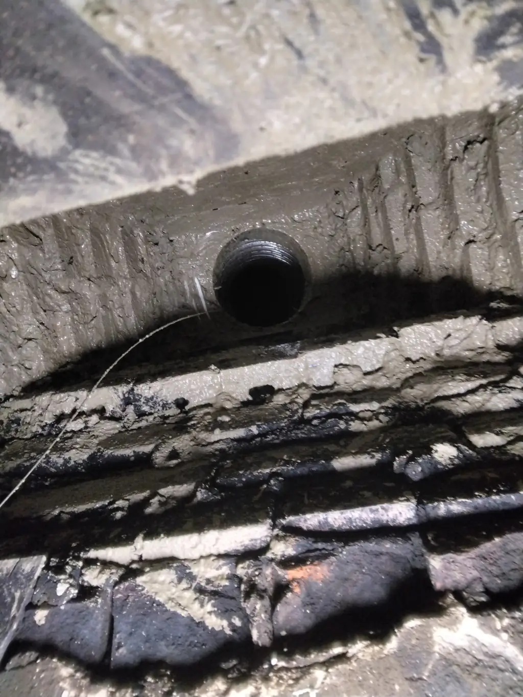 Smoke chamber in a Bethel Park, PA fireplace after parging, with the stepped brick troweled smooth and sealed